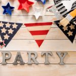 Party,Sign,With,July,4th,Decorations,On,Wood,Boards.