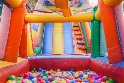 Inflatable,Castle,Full,Of,Colored,Balls,For,Children,To,Jump