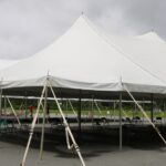 White,Events,Tent,With,Chairs,Being,Put,Into,Place