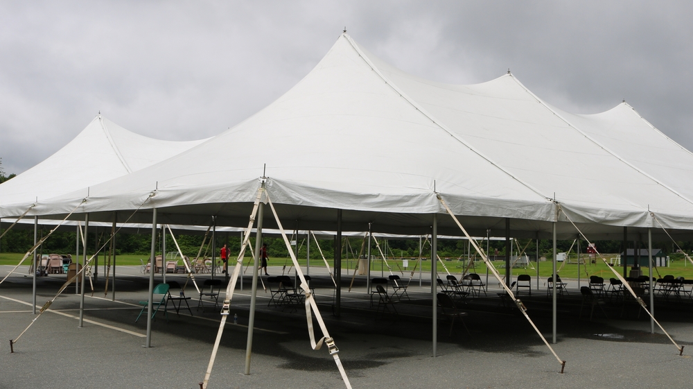 White,Events,Tent,With,Chairs,Being,Put,Into,Place