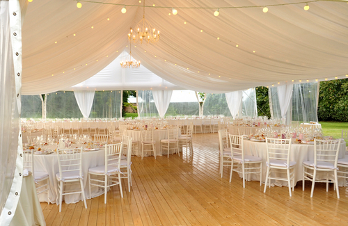 Elegant,open,air,white,marquis,for,a,wedding,venue,with